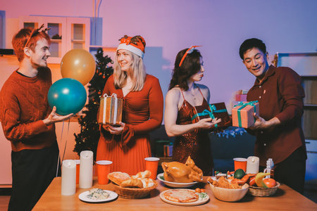 Festive Office Christmas Party with Delicious Food. A beautifully decorated office space with...