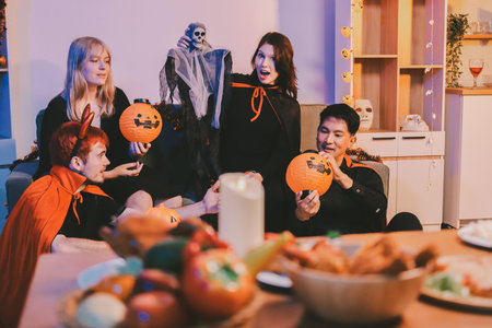 Friends enjoying a Halloween party making a toast