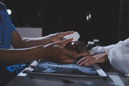 Doctors are meeting at the hospital to discuss treatment options and share experiences with colleagues.の写真素材