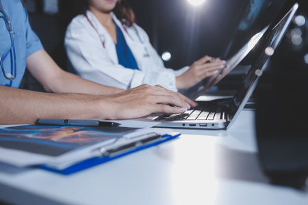 Doctors are meeting at the hospital to discuss treatment options and share experiences with colleagues.の写真素材