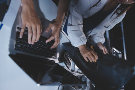 Doctors are meeting at the hospital to discuss treatment options and share experiences with colleagues.の写真素材