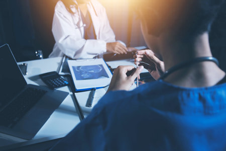 Doctors are meeting at the hospital to discuss treatment options and share experiences with...