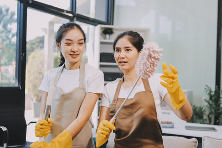 Cleaners clean empty office spacesの写真素材