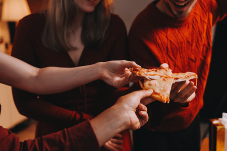 Festive Office Christmas Party with Delicious Food. A beautifully decorated office space with...
