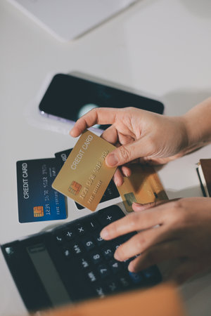Online payment, Hands of woman holding a credit card and using smart phone for online shopping