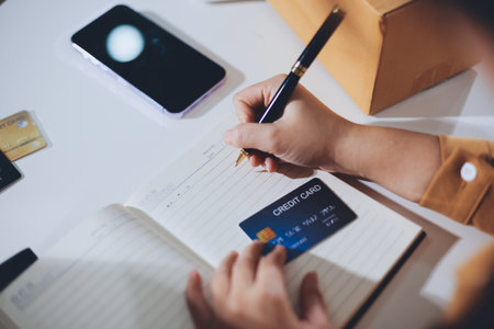Online payment, Hands of woman holding a credit card and using smart phone for online shopping