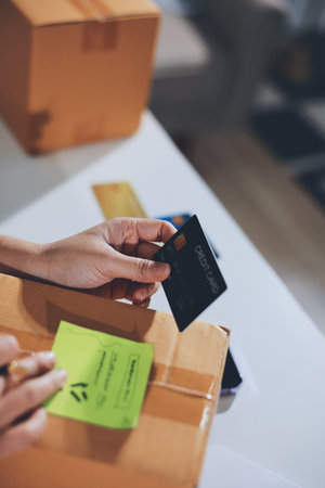 Hands of woman holding a credit card