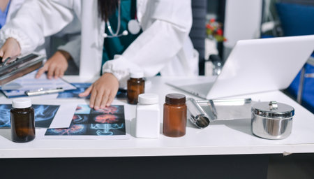 Doctor Explaining X-Ray Results to a Patient Using a Digital Device