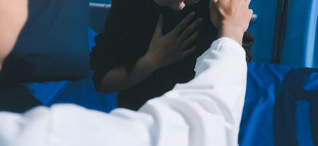Doctor holding patient's hands offering comfort and support