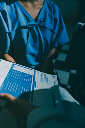 healthy concept; Doctor checking patient's heart with stethoscope at a hospital