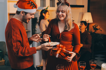 Festive Office Christmas Party with Delicious Food. A beautifully decorated office space with Christmas trees and festive lights, set up for a holiday party.の写真素材
