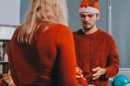 Festive Office Christmas Party with Delicious Food. A beautifully decorated office space with Christmas trees and festive lights, set up for a holiday party.の写真素材