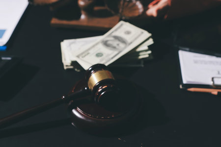 Consultation and conference of professional businesswoman and Male lawyers working and discussion having at law firm in office. Concepts of law, Judge gavel with scales of justiceの写真素材