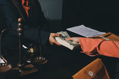 Consultation and conference of professional businesswoman and Male lawyers working and discussion having at law firm in office. Concepts of law, Judge gavel with scales of justiceの写真素材