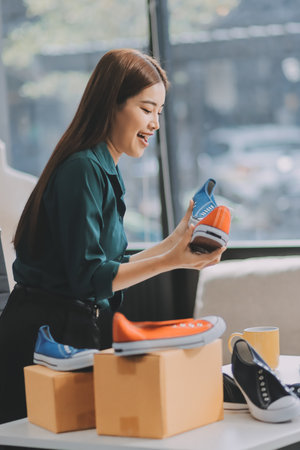 Starting small businesses SME owners female entrepreneurs check online orders to prepare to pack the boxes, sell to customers, sme business ideas online.の写真素材