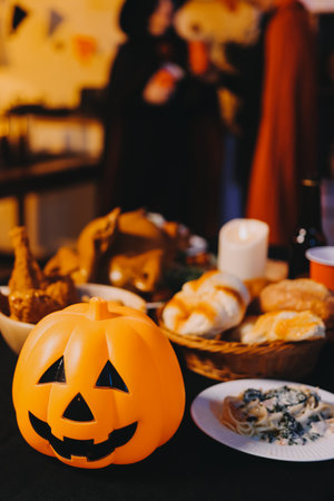 Friends enjoying a Halloween party making a toastの写真素材