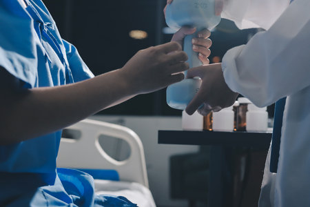Physical therapist assisting a woman with dumbbell exercise