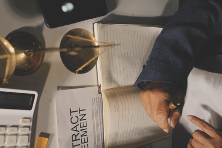 Businesswoman and Male lawyer or judge consult and conference having team meeting with client at law firm in office, Law and Legal services conceptの写真素材