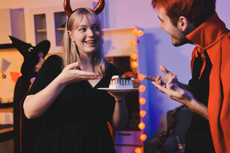 Friends enjoying a Halloween party making a toast