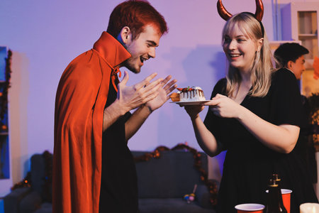 Friends enjoying a Halloween party making a toast