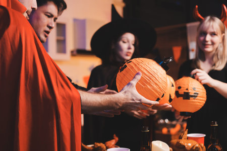Friends enjoying a Halloween party making a toast
