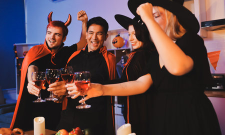 Friends enjoying a Halloween party at a bar making a toast