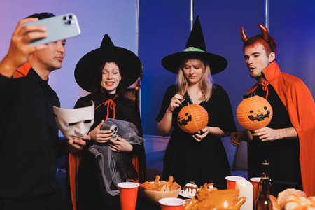 Friends enjoying a Halloween party at a bar making a toast