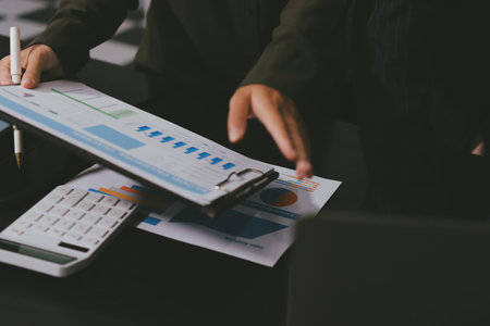 business people in meeting discussing plans togetherの写真素材