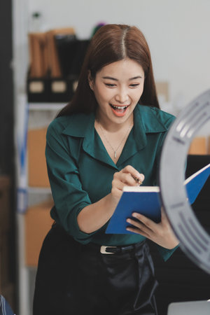 Starting small businesses SME owners female entrepreneurs check online orders to prepare to pack the boxes, sell to customers, sme business ideas online.の写真素材