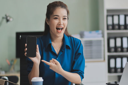 Young Asian businesswoman giving presentationの写真素材