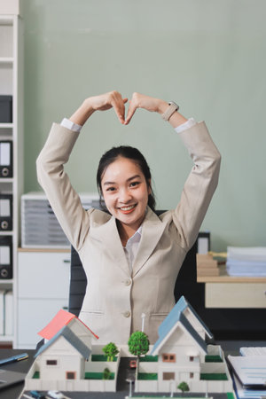 real estate agent home miniature model on documents sale and purchase of apartment notarial deedの写真素材