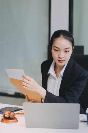 Lawyer explained to the client about the law that must be brought against the court case.の写真素材