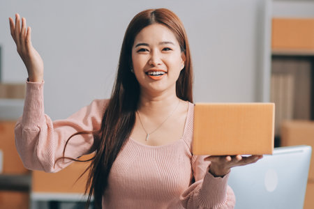 Starting small businesses SME owners female entrepreneurs check online orders to prepare to pack the boxes, sell to customers, sme business ideas online.の写真素材