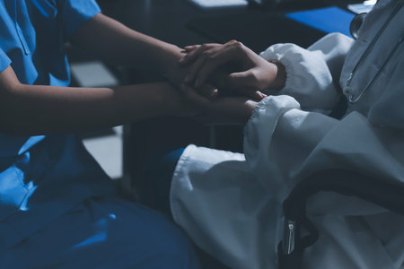Doctors shake hands with patients encouraging each other and praying for blessings. To offer love,...