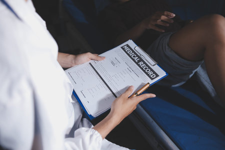 Rehabilitation therapy Professional male physiotherapists working in rehabilitation centers while treating male patients with leg and muscle pain.の写真素材