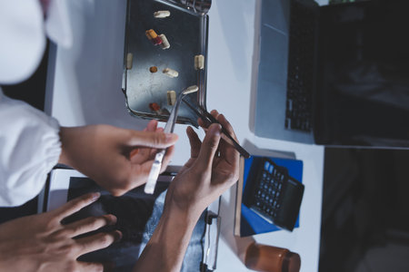 Doctors are meeting at the hospital to discuss treatment options and share experiences with colleagues.の写真素材