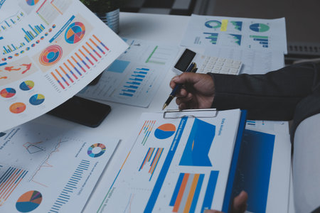 Auditor and accountant team working in office, analyze financial data and accounting record with...