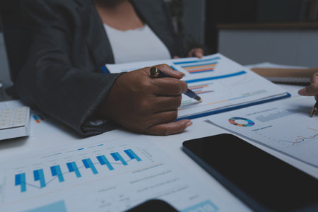 Auditor and accountant team working in office, analyze financial data and accounting record with...