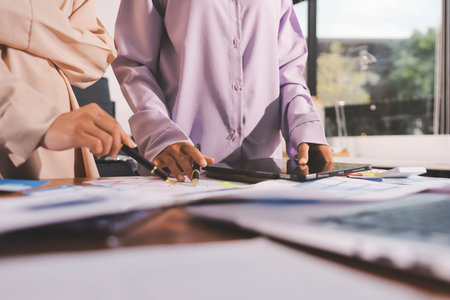 Close up ux developer and ui designer brainstorming about mobile app interface wireframe design on table with customer breif and color code at modern office.Creative digital development agency.の写真素材