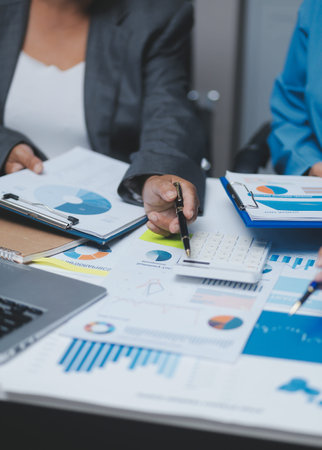 Auditor and accountant team working in office, analyze financial data and accounting record with calculator. Accounting company provide finance and taxation planning for profitable cash flow.の写真素材