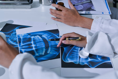 Doctor Explaining X-Ray Results to a Patient Using a Digital Device