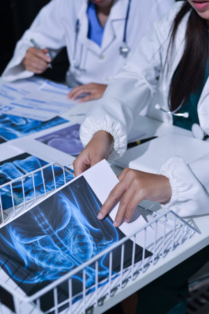 Doctor Explaining X-Ray Results to a Patient Using a Digital Device