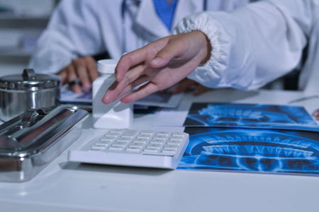 Doctor Explaining X-Ray Results to a Patient Using a Digital Device