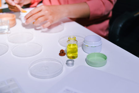 Woman making organic cosmetics with aloe in laboratory