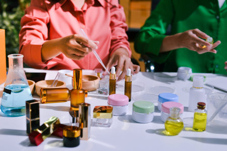 Woman making organic cosmetics with aloe in laboratoryの写真素材