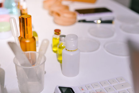 Woman making organic cosmetics with aloe in laboratoryの写真素材
