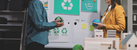 Two business people team planning and discussing of sustainable and renewable clean energy product...