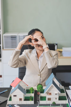real estate agent home miniature model on documents sale and purchase of apartment notarial deedの写真素材