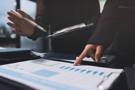 business people in meeting discussing plans togetherの写真素材