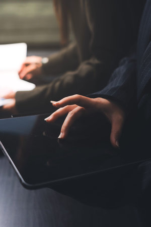 business people in meeting discussing plans togetherの写真素材